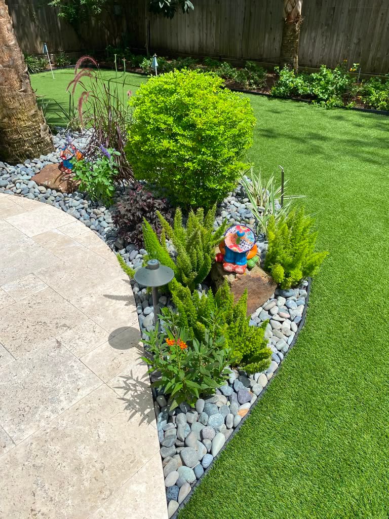 Completed planting arrangement in a residential outdoor area
